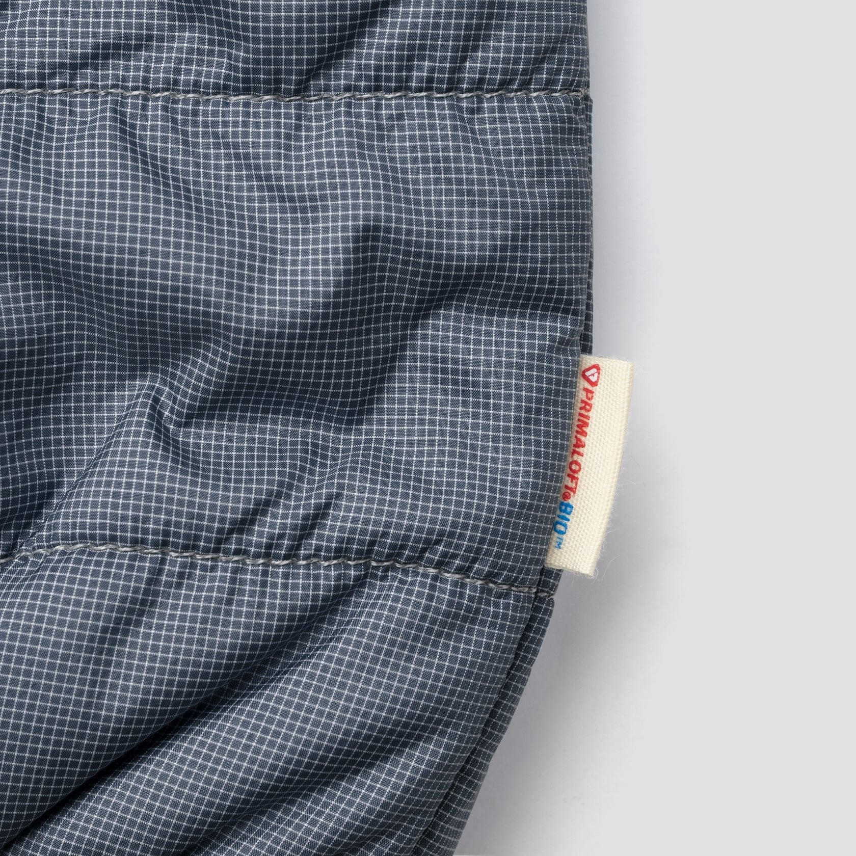 Glow reversible primaloft jacket underground – true navy / bluebalu